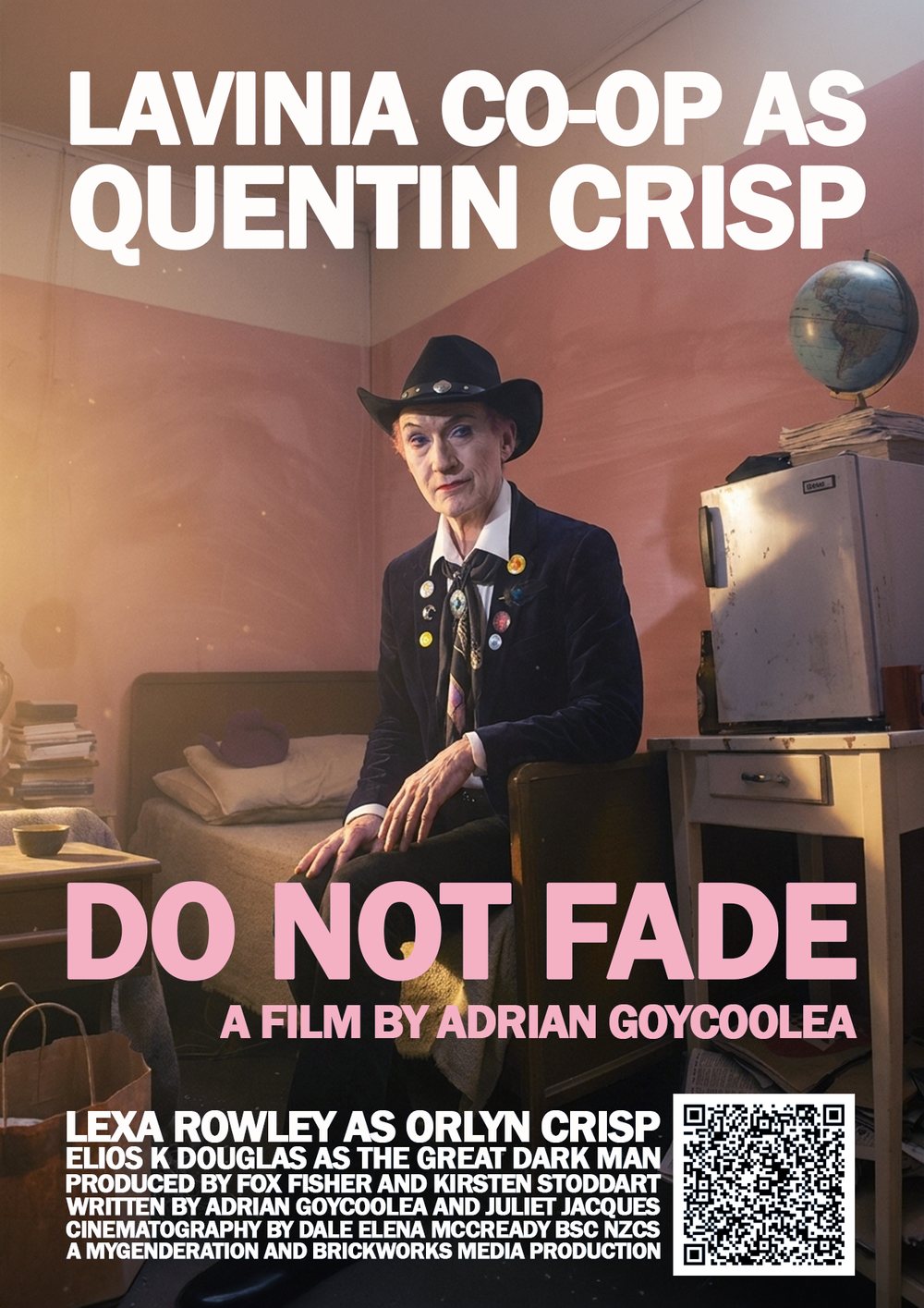 Poster. Lavinia Co-op as Quentin Crisp sits on the end of a narrow bed in a pink-walled room, in a black cowboy hat and velvet jacket, beside a small fridge with a globe on top.